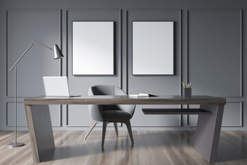Two empty mockup canvases in grey minimalist office