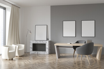 Two frames and standing artwork in modern white and grey office