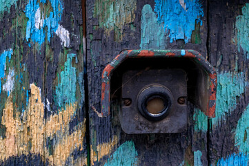 Close up of old weathered door bell