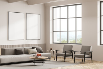 Bright living room interior with two empty white posters, armchairs