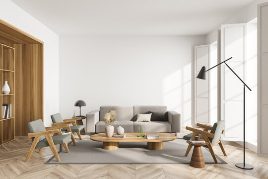 Light living room interior with sofa and armchairs on parquet floor, mockup