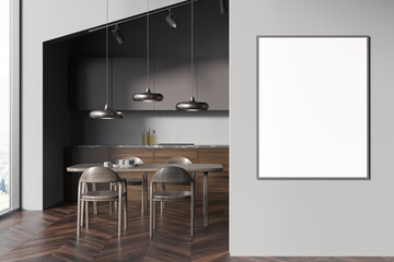 Dark kitchen interior with dining table and chairs, window and mockup poster
