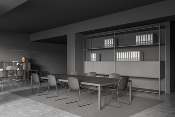 Grey business room interior with chairs, table and shelf on concrete floor