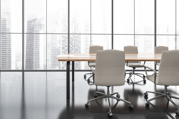 Light conference room interior with furniture and windows with city view