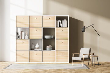 Light relaxing room interior with armchair and bookshelf with decoration © ImageFlow