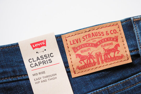 Moscow, Russia - June, 2021: Levis logo and badges is displayed on  jeans. Brand name of Levi Strauss and Co, founded in 1853