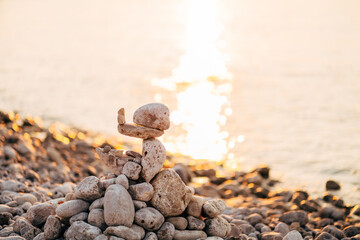 Stones stacked on top of each other by the sea
