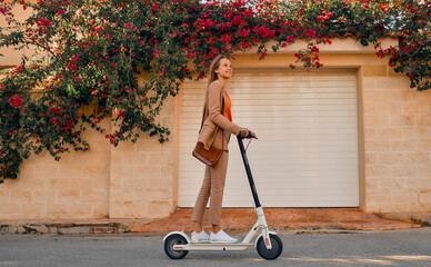 Business lady riding scooter