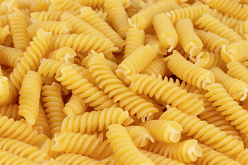 Variety of types and shapes of dry Italian pasta. Close up.