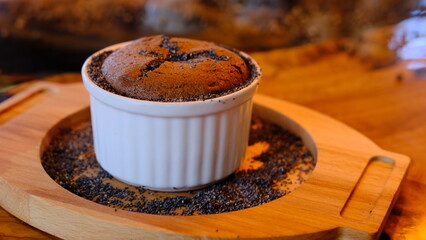 Chocolate souffle in classic souffle ramekin.