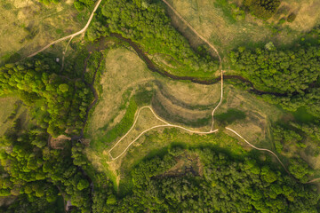 Drone view of summer hill and tourist nature trail