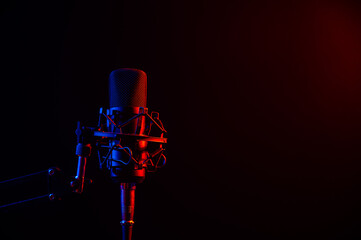 Professional microphone in pink smoke on a black background.