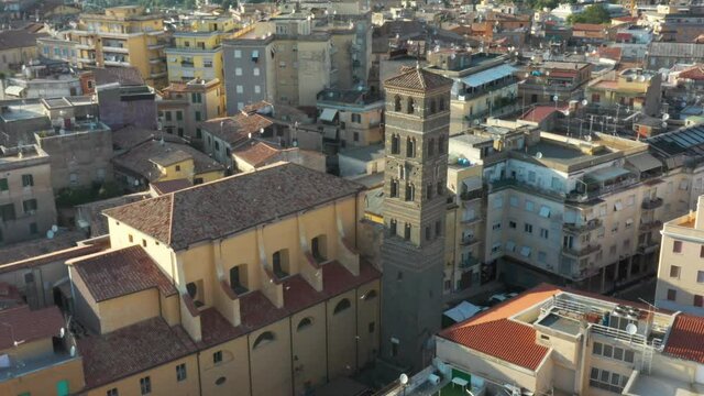 The city of Velletri, Castelli Romani (Rome) - Aerial 4K - Flying above Torre del Trivio as birds pass by