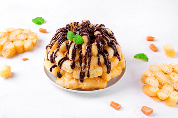 Cake with sweet corn sticks and caramel topped with chocolate glazing. Soviet cuisine dessert