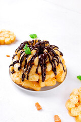 Cake with sweet corn sticks and caramel topped with chocolate glazing. Soviet cuisine dessert