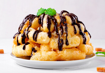 Cake with sweet corn sticks and caramel topped with chocolate glazing. Soviet cuisine dessert