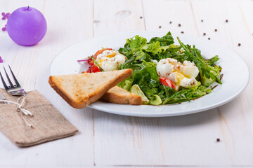 fresh salad with arugula, tomato and egg
