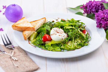 fresh salad with arugula, tomato and egg