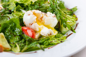 fresh salad with arugula, tomato and egg