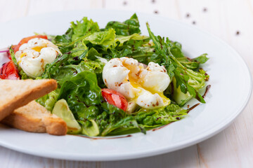 fresh salad with arugula, tomato and egg