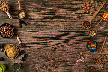 Still life with chocolates, hazelnuts, coffee, chocolate cookies, star anise and more details