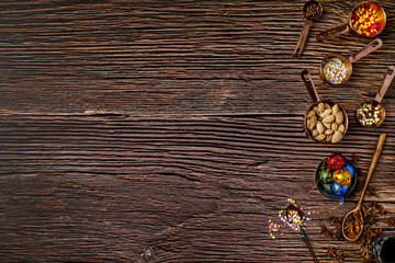 Still life with chocolates, hazelnuts, coffee, chocolate cookies, star anise and more details