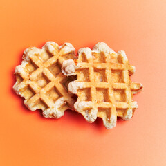  Two delicious waffles over orange background