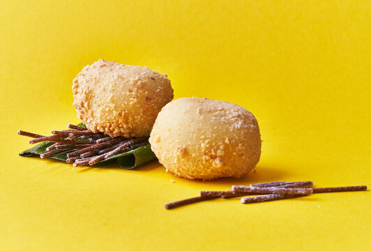  Two delicious mochis on a yellow background