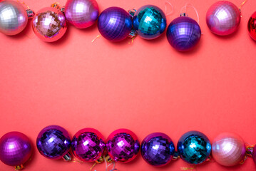 Christmas composition. Christmas red decorations, Christmas tree toys on a red background.