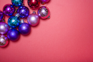 Christmas composition. Christmas red decorations, Christmas tree toys on a red background.