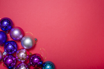 Christmas composition. Christmas red decorations, Christmas tree toys on a red background.