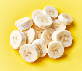  Slices of banana on a yellow background
