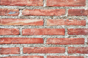 Brick wall texture with cracked tiles and cement. Classic brickwall surface background
