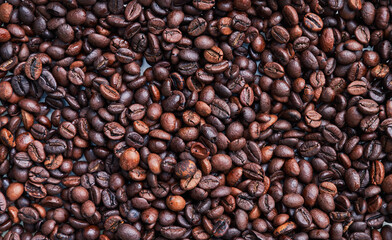 Brown and black coffee beans. Roasted arabic espresso coffee grains.