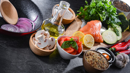 Fresh food ingredients prepared for cooking on a kitchen table