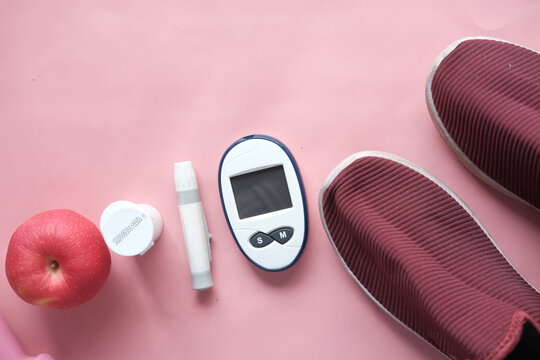  Diabetic Measurement Tools, Shoe And Apple On Table 