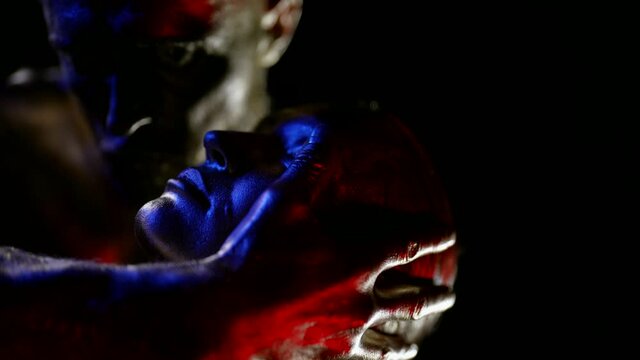 seduction and temptation, two lovers are caressing each other in darkness