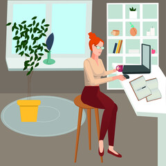 Freelance girl working at home on a computer.