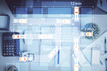 Auto pilot hologram drawing over computer on the desktop background. Top view. Double exposure. Tech concept.