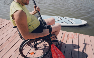 Person with a physical disability in a wheelchair will be ride on sup board