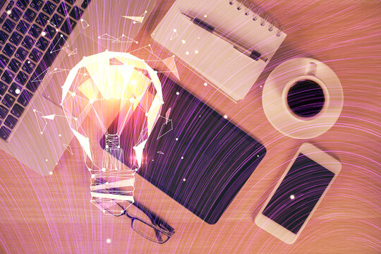 Double exposure of bulb drawing over table with phone. Top view. Concept of idea.