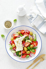 Greek or horiatiki salad with fresh vegetables and feta cheese, dressed with olive oil, traditional Greek cuisine salad