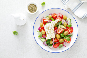 Greek or horiatiki salad with fresh vegetables and feta cheese, dressed with olive oil, traditional Greek cuisine salad