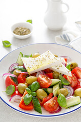 Greek or horiatiki salad with fresh vegetables and feta cheese, dressed with olive oil, traditional Greek cuisine salad