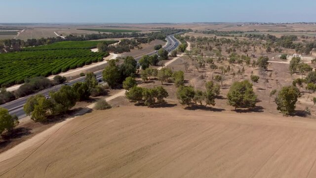 A drone flying ower a highway and flies in an arc in southern Israel between Netivot and Sderot