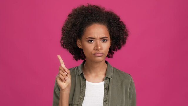 Strict lady finger mouth ask dont share news isolated fuschia color background