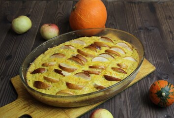 homemade apple and pumpkin pie on wooden background