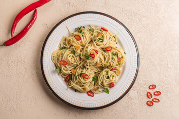 Italian pasta aglio e olio with olive oil, garlic and chili pepper. Flat lay.