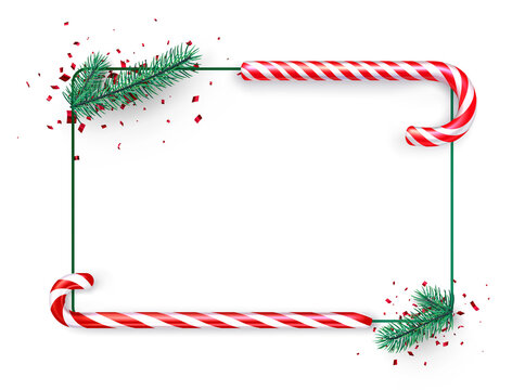 Candy canes with fir branches frame.