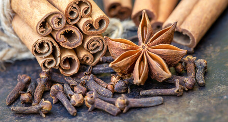 Christmas,  thanksgiving  spices banner, cloves, star anise and cinnamon sticks in the kitchen, cooking concept